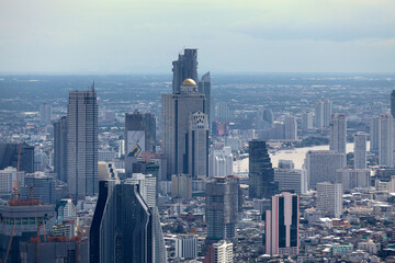 Fototapeta premium Aerial view of the State Tower near the Chao Praya River in Bangkok