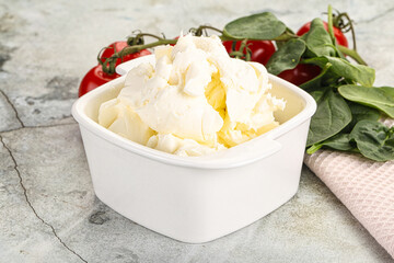 Soft cream cheese in the bowl