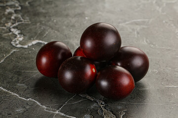 Raw ripe black kumato tomato