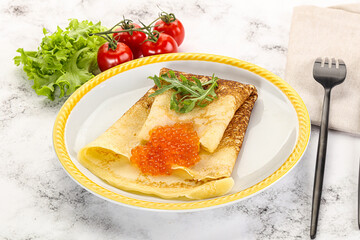 Russian pancake with red caviar