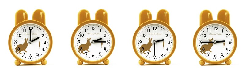 close up of a set of cute brown alarm clocks showing the time; 2, 2.15, 2.30 and 2.45 p.m dan a.m....