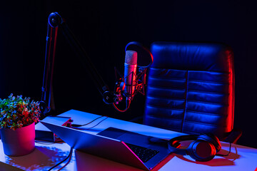 Home studio podcast interior. Microphone, table and chair