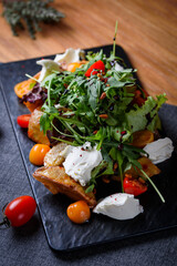 crispy eggplant with cheese and tomatoes, herbs