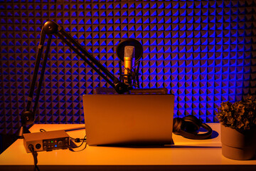 Home studio podcast interior. Microphone, table and chair