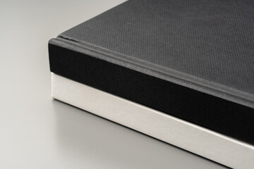 Blank notepad on gray background studio shot