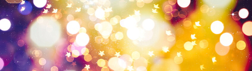 Abstract light celebration background with defocused golden lights for Christmas, New Year,...