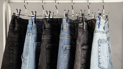 Jeans on a hanger. Modern, youth women's denim trousers.