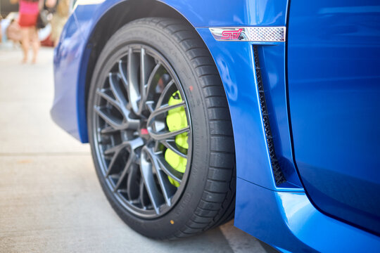 Berlin, Germany - August 20, 2022: Subaru Impreza WRX Sti detail shot. Sti badges logo emblem on wing selective focus close up.