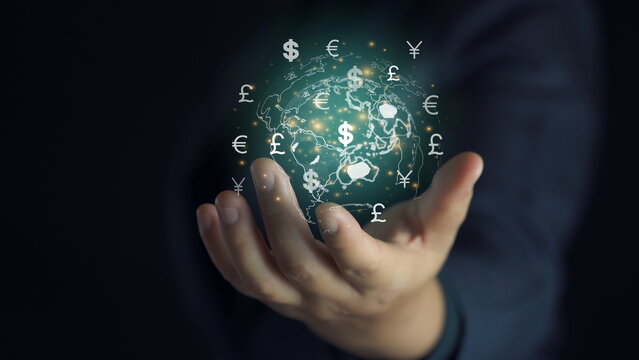 Businessman holding virtual world with banknote and currency sign include USD dollar Pound sterling Euro Yuan Yen and Ruble for forex money exchange and transfer concept.