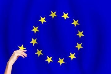 European Union flag and hand with star. EU concept