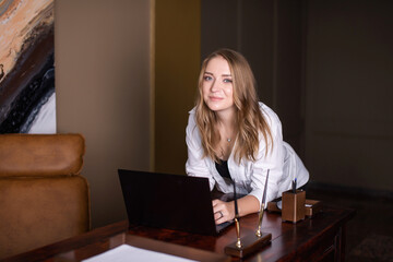 Woman at Desk with Laptop