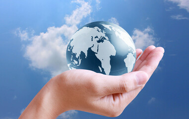 holding globe in his hand