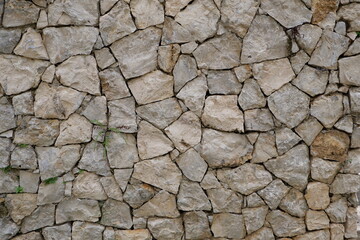 Stone wall background with crack pattern texture