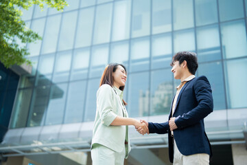 Photo of two young Asian businesspeople