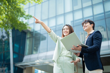 Photo of two young Asian businesspeople