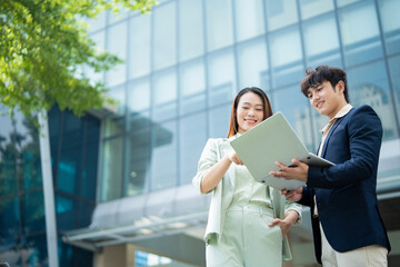 Photo of two young Asian businesspeople