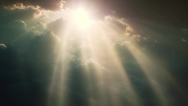 Sun rays shining through dark clouds. 