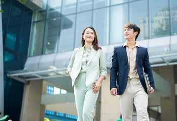 Photo of two young Asian businesspeople