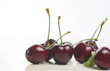 Red cherry on white marble