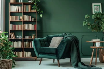 Poster Cozy reading nook with comfortable armchair and bookshelves. Home interior design. © Postproduction