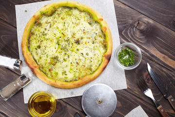 tasty pizza on the wooden background