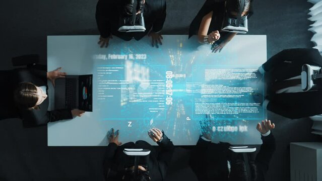 Skilled project manager working on laptop and sending data analysis to business people by using VR glass with hologram of financial coding program or holographic software development. Directorate.