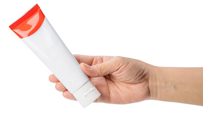 Woman's hand holding blank white plastic tube on white background. Cosmetic beauty product branding...