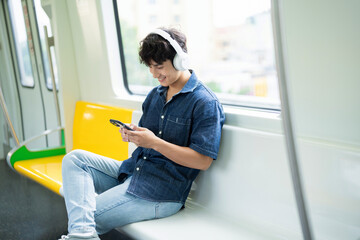 Young Asian man on the metro