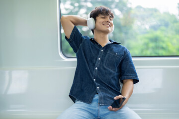Young Asian man on the metro