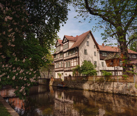 spring trip to Europe. Travel and German sightseeing locations. scenic view to facade of old historic houses somewhere in Erfurt city, Traditional half-timbered houses makes cozy and fairy tail mood