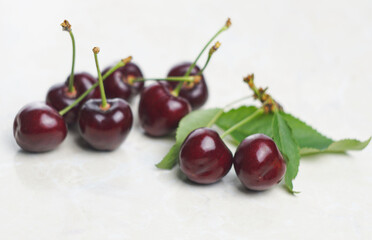 Red cherry on white marble