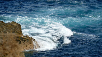 waves crashing on rocks