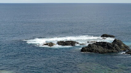 waves crashing on rocks