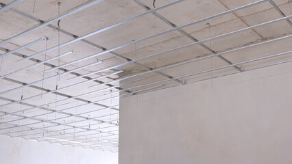 Aluminum c-line ceiling outline over corridor inside of modern house building structure in...