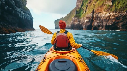 Man in Yellow Jacket Paddling Kayak on Water