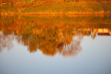 glare and reflections on the water. the sky is reflected in the water. Background of waves,...