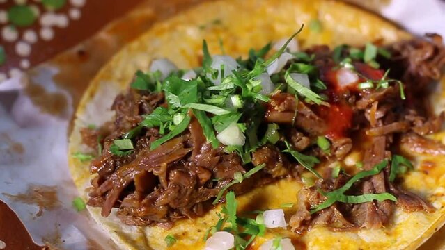slow motion slider of beef birria taco. Mexican food