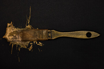 A Brush Stained With Gold Paint