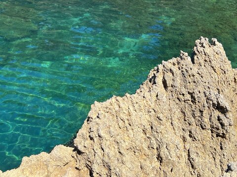 Turquoise blue sea and rocks 
