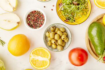 Vegan, summer food. FODMAP, Mediterranean, KETO plant based diet food. Fruits, vegetables, greens, citrus, olives. Detox, healthy lifestyle background