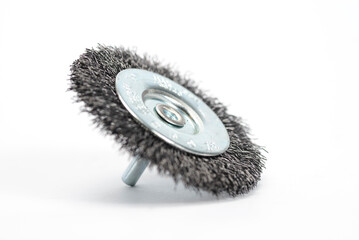 Steel brush disc for drill machine on white background