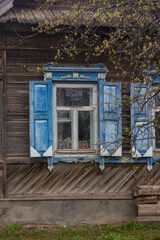 old wooden house with carved windows in the Russian village