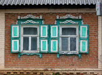 old wooden house with carved windows in the Russian village