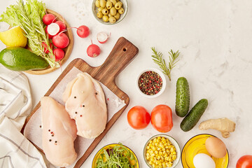 Organic vegetables, fruits, eggs, chicken fillet, olives and greens. Keto, Paleo, Low carb, FODMAP diet concept. Flat lay food, copy space