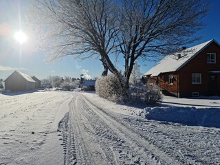 sunny winter morning by old house