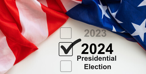 Presidential Election 2024 text on a mini chalkboard over a vintage background with part of the...