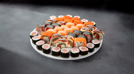 Assorted sushi and maki rolls platter with tuna, salmon, and eel, perfect for a Japanese cuisine experience