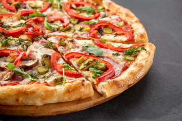 Meat lovers' pizza with bacon, ham, marinated pickles, and paprika, bursting with flavors and toppings