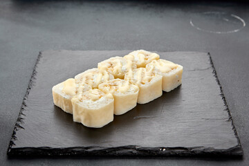 Sweet roll with coconut flakes in a pancake, a delightful fusion of Japanese and Western dessert traditions