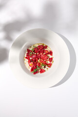 Beetroot Ravioli Bows in Cream Sauce, Top View with Delicate Shadow, Ideal for Artistic Food Photography